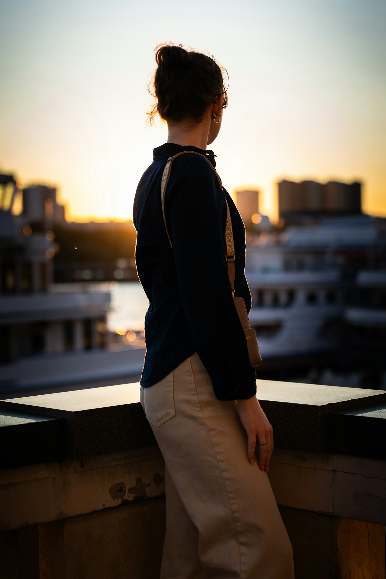 Navy shirt with cream trousers at golden hour
