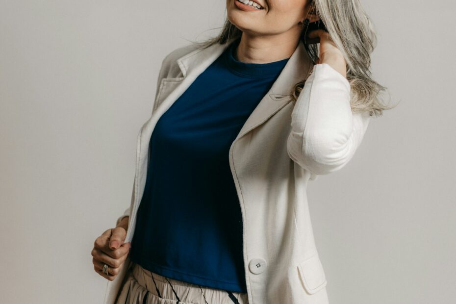 Navy top with a cream blazer and cream linen trousers