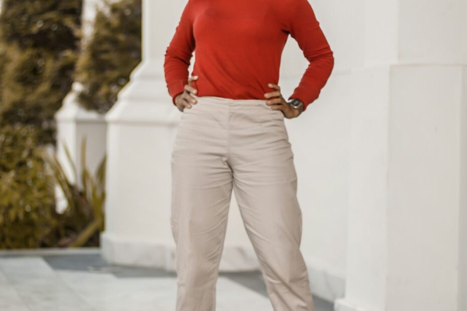 Red top with cream trousers and red heels: cream as the larger piece